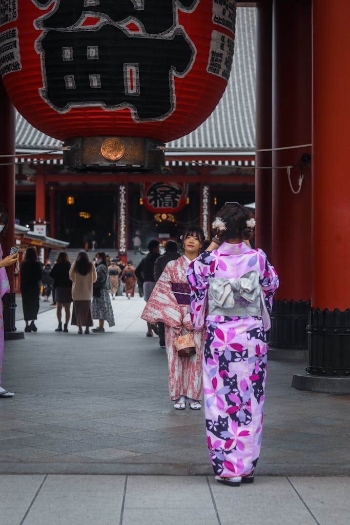 Tourists in traditional kimono at Senso-ji Temple in Tokyo, capturing the essence of Japanese culture.